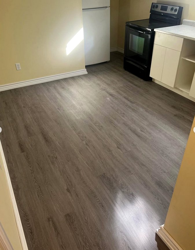 Grey vinyl click flooring in a kitchen